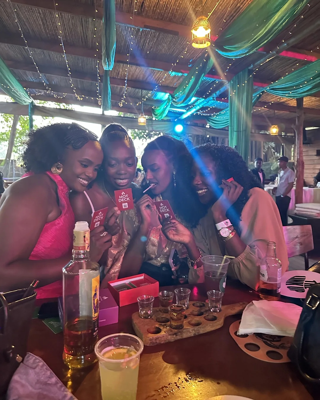 Friends playing Hot Deck card games at the bar
