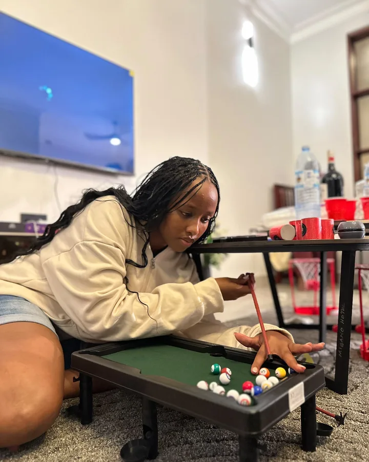Playing mini pool indoors